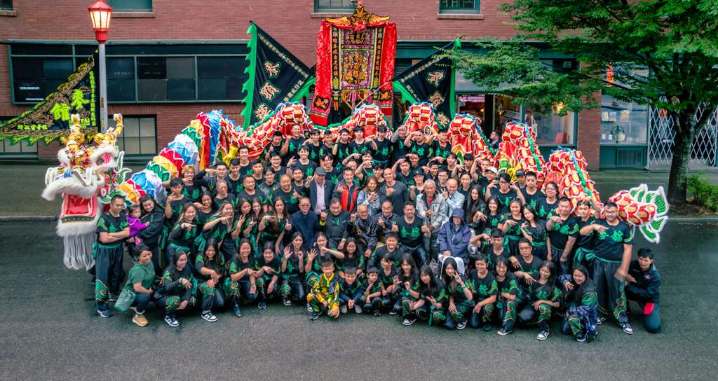 The full Mak Fai association gathered outside the kwoon in Seattle&rsquo;s Chinatown-International District, with lions, dragons, and ceremonial banners