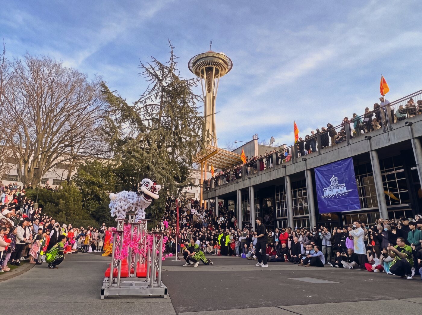 A Mak Fai lion dance performance in front of the Space Needle at a Seattle community event